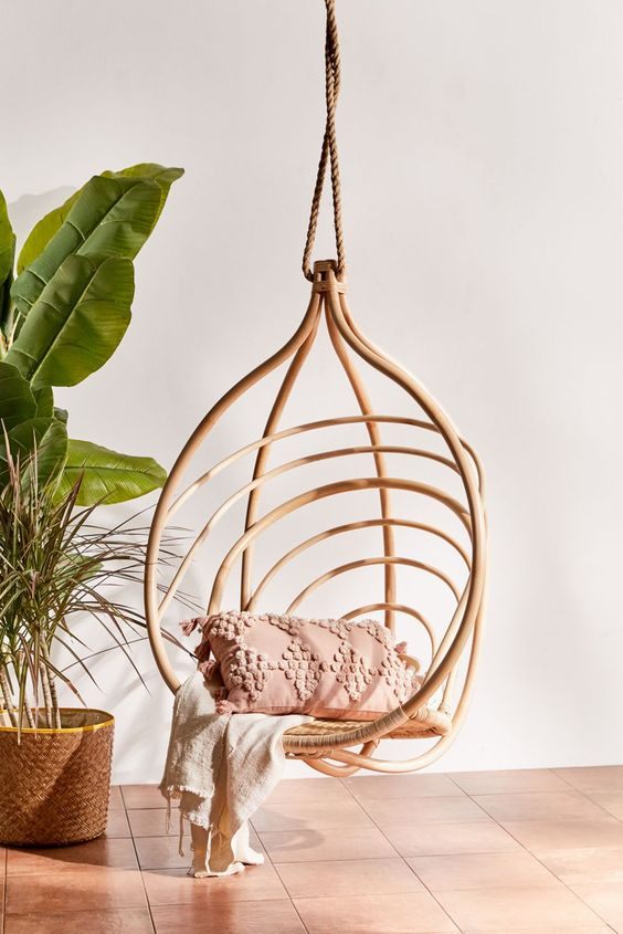Handcrafted Rattan Hanging Swing Chair Inspired by Modern Tropical Living